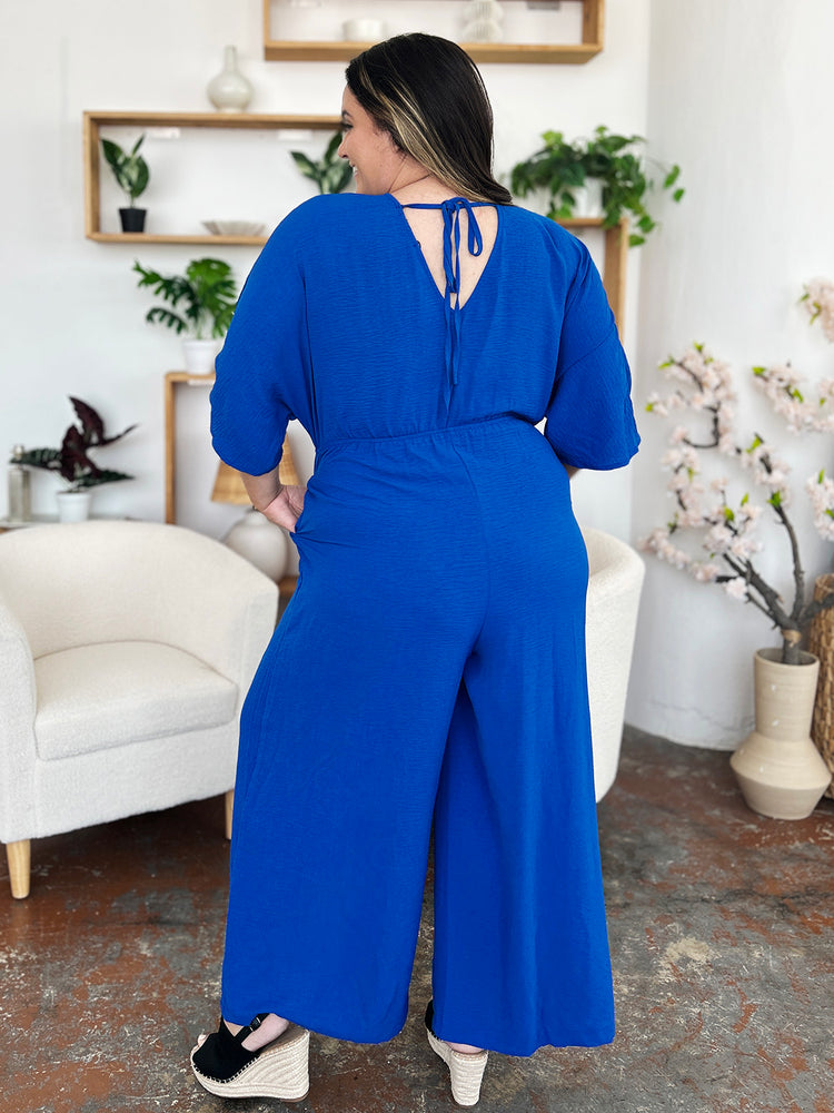 
                  
                    Surplice Wide Leg Jumpsuit with Pockets
                  
                