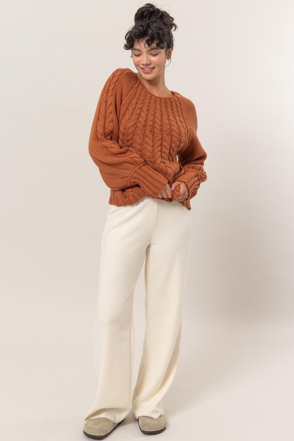 
                  
                    Cable-Knit Round Neck Raglan Sleeve Sweater
                  
                