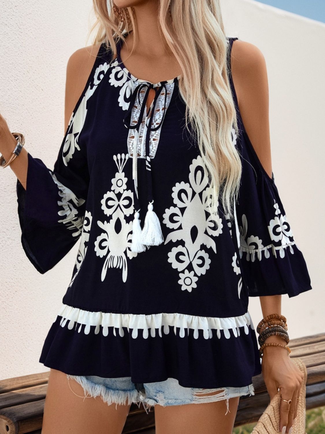 
                  
                    Tassel Printed Tie Neck Cold Shoulder Blouse
                  
                