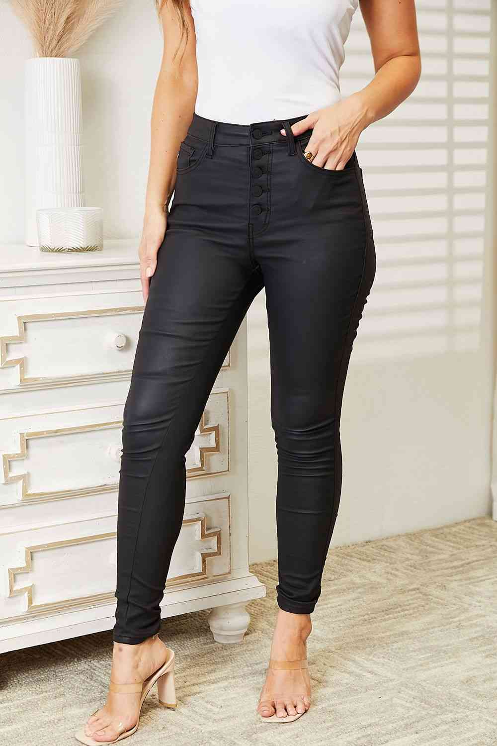 
                  
                    High Rise Black Coated Skinny Jeans
                  
                