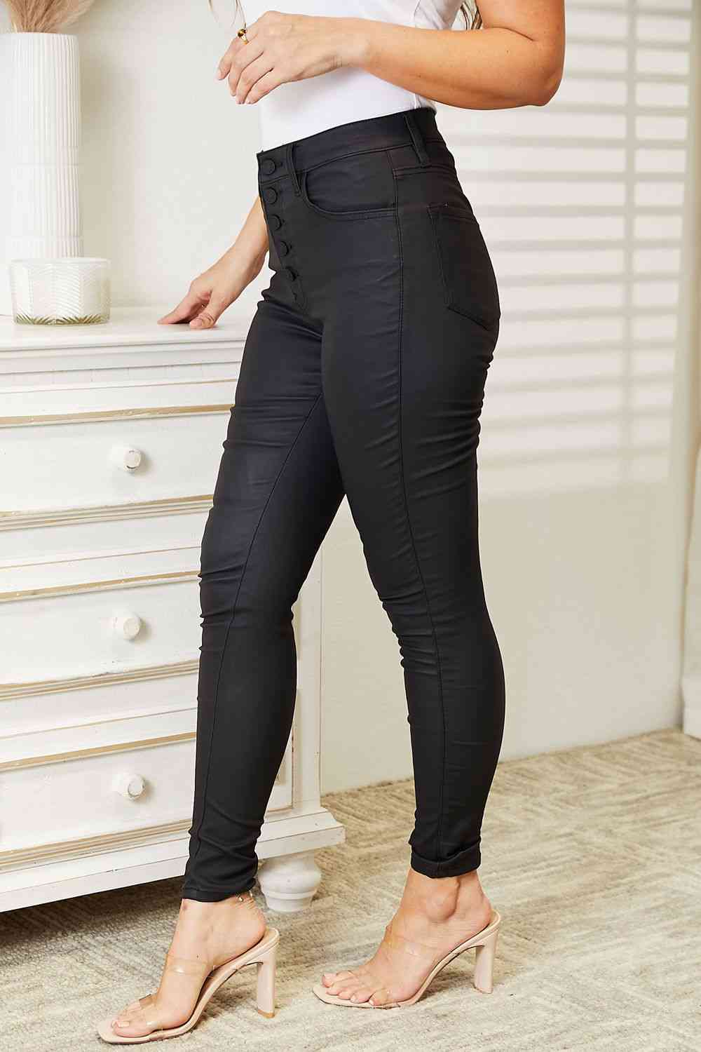 
                  
                    High Rise Black Coated Skinny Jeans
                  
                